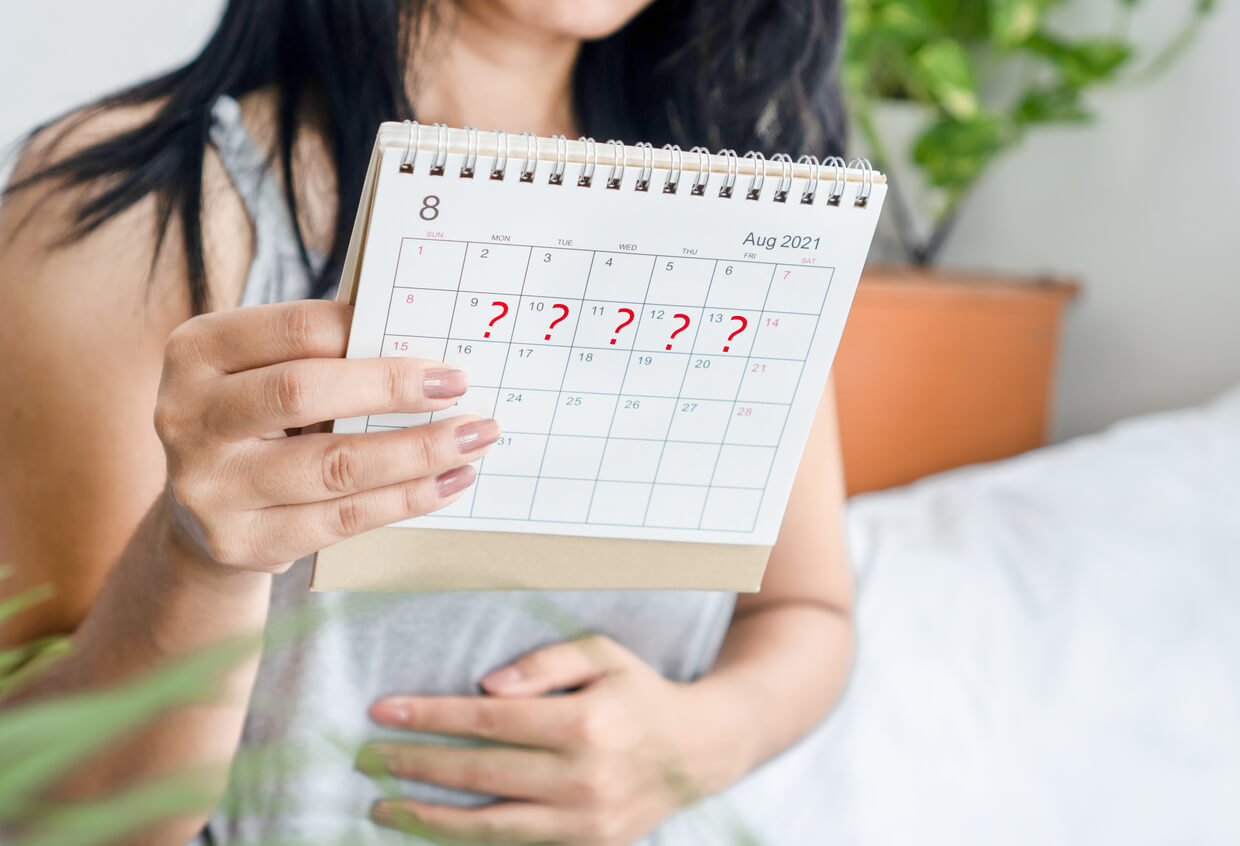 Woman tracking menstrual cycle for irregular periods